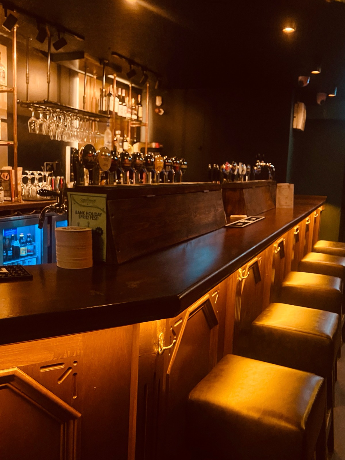 The bar at The Christchurch, taps lined up and ready to pour